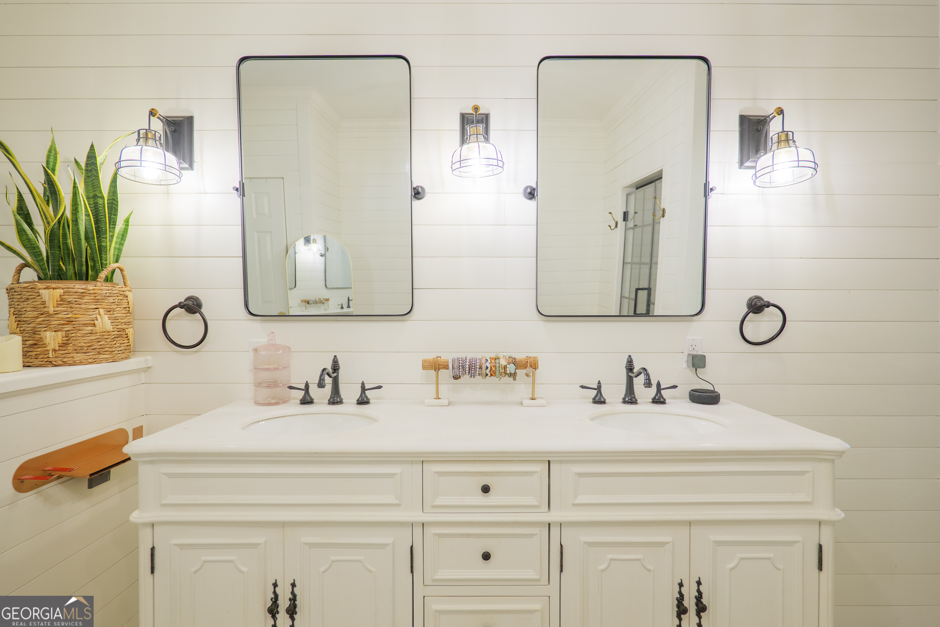 7552 Webb Road Hahira, GA 31632 - Photo 24 of 57 a bathroom with double vanity sinks and a mirror