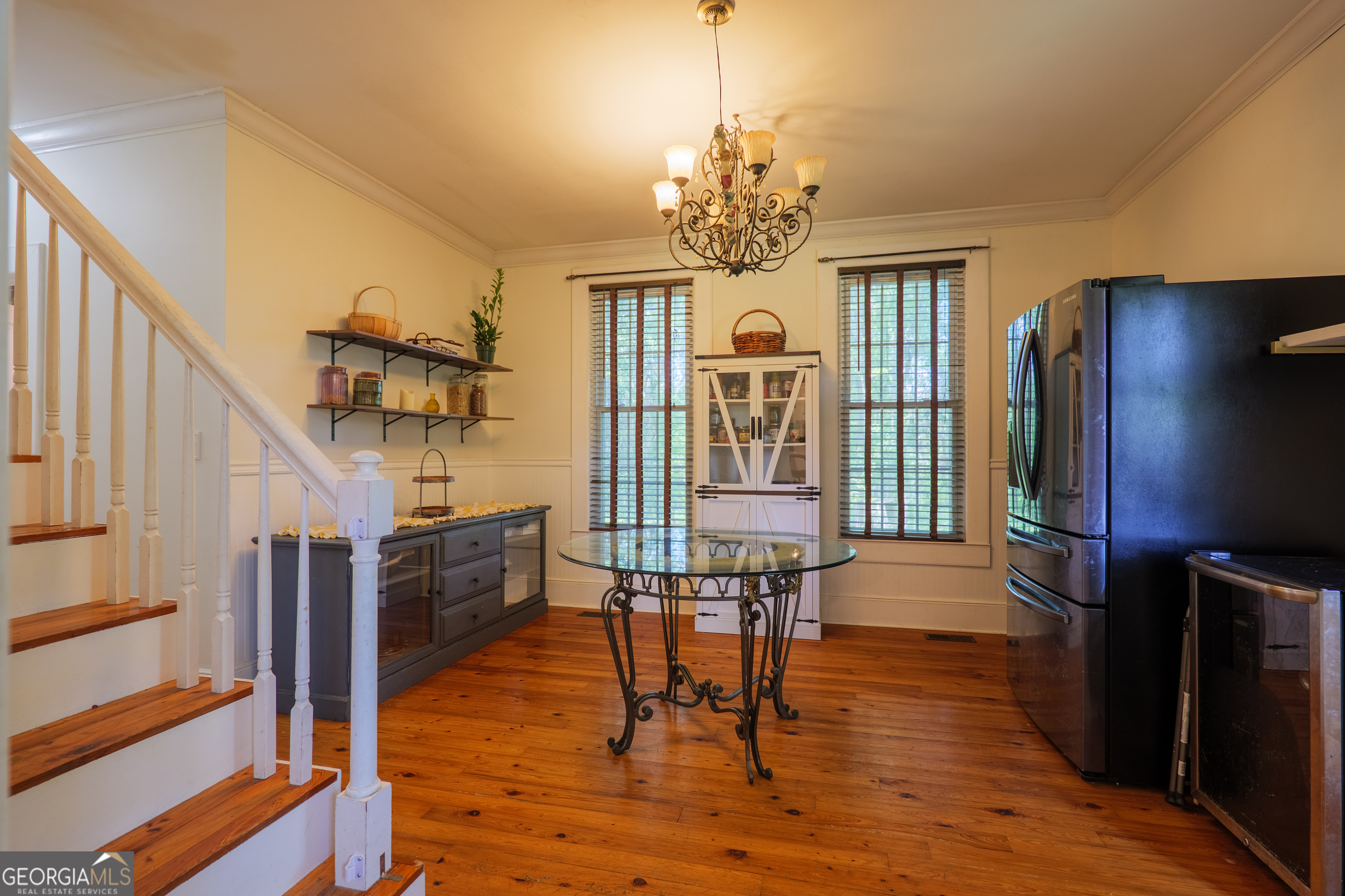 7552 Webb Road Hahira, GA 31632 - Photo 28 of 57 a view of a livingroom with wooden floor and staircase