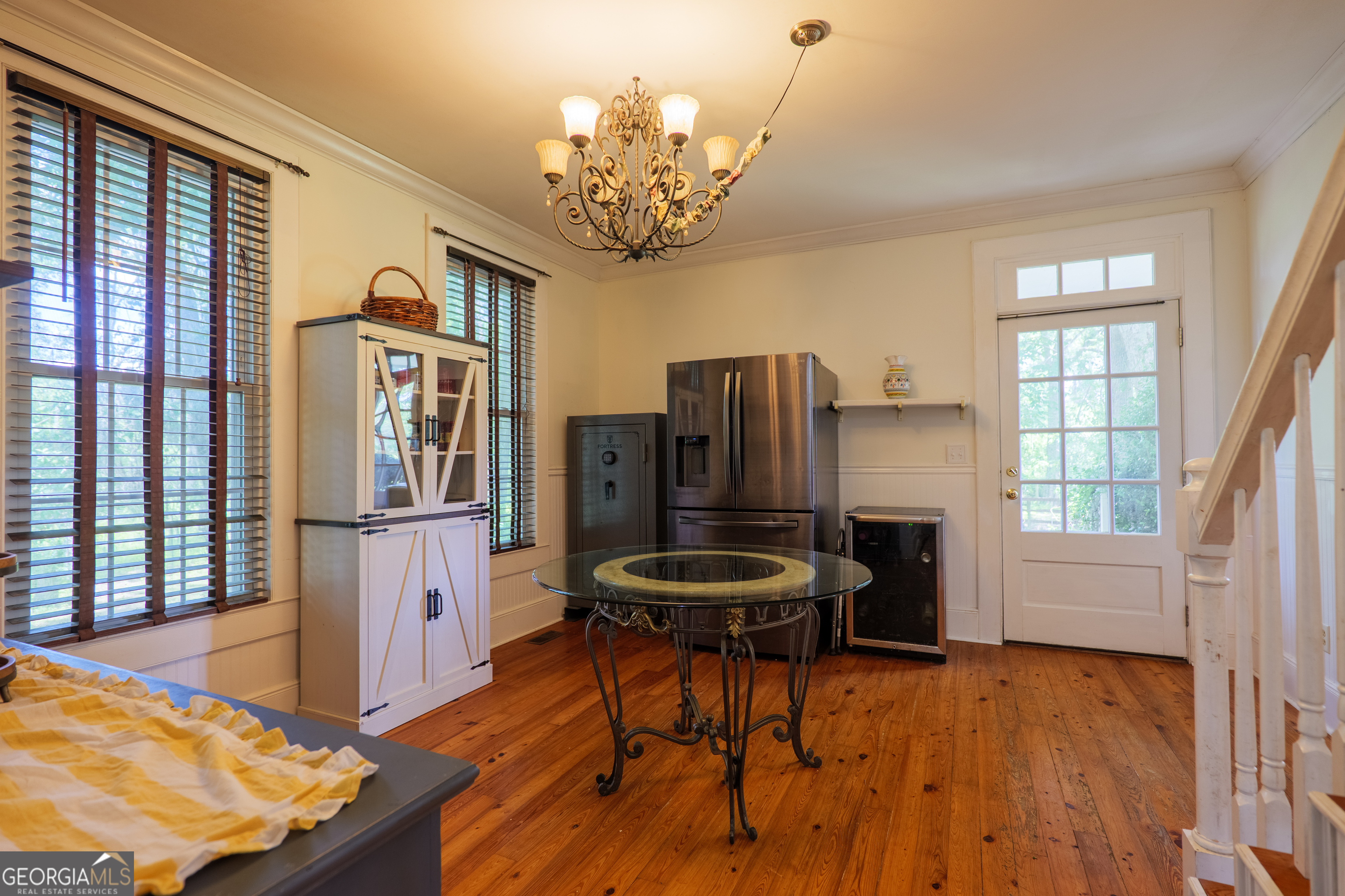7552 Webb Road Hahira, GA 31632 - Photo 29 of 57 a living room with furniture a fireplace and a large window