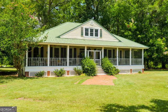 a front view of a house with a yard and porch