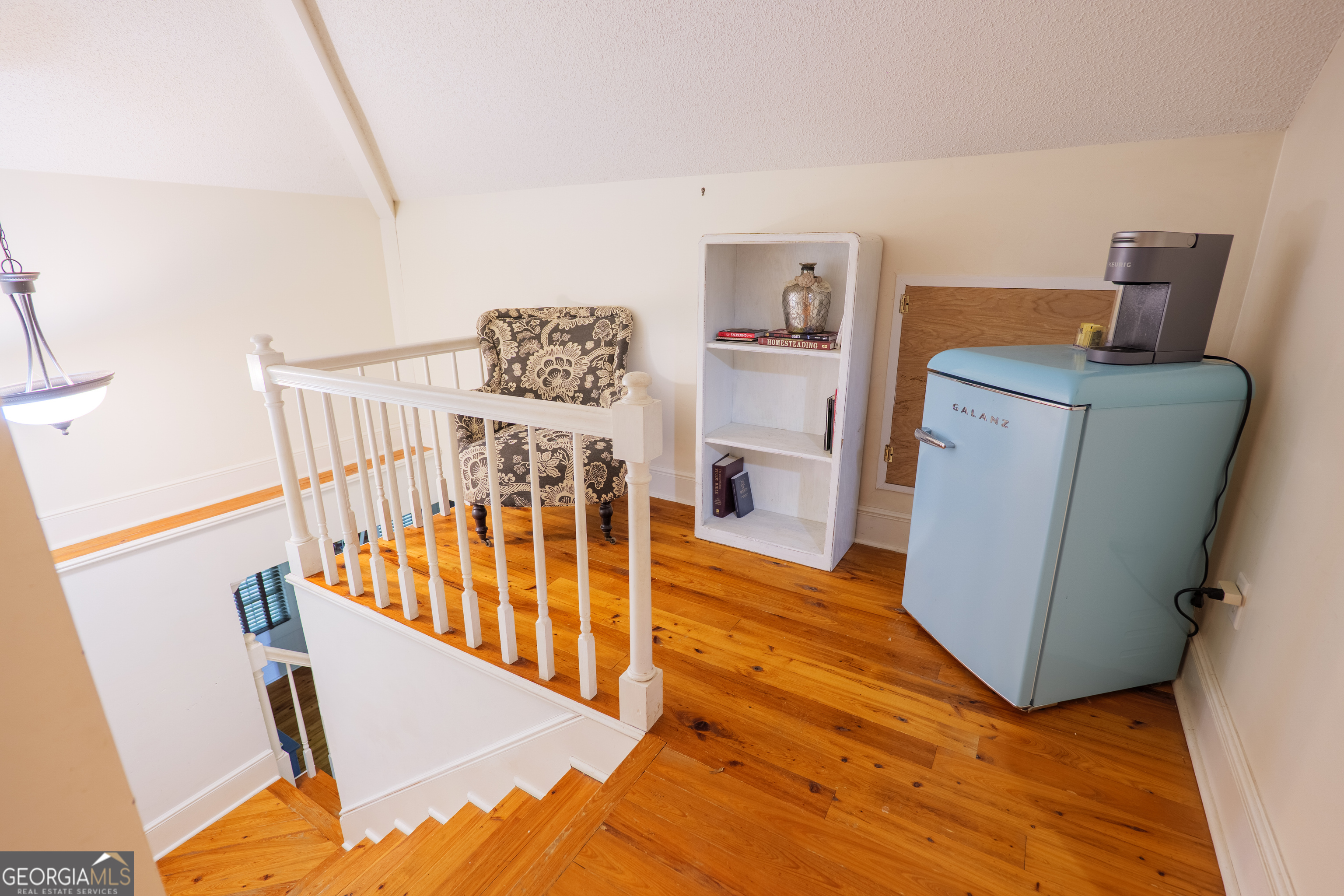 7552 Webb Road Hahira, GA 31632 - Photo 33 of 57 a view of a hallway with wooden floor and staircase