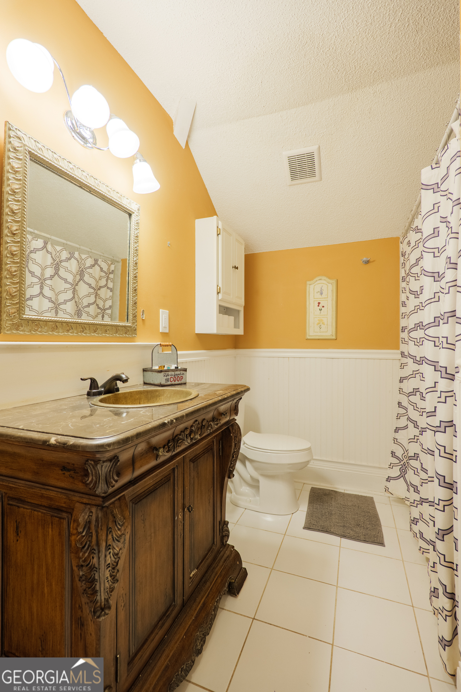 7552 Webb Road Hahira, GA 31632 - Photo 40 of 57 a bathroom with a sink a toilet and mirror