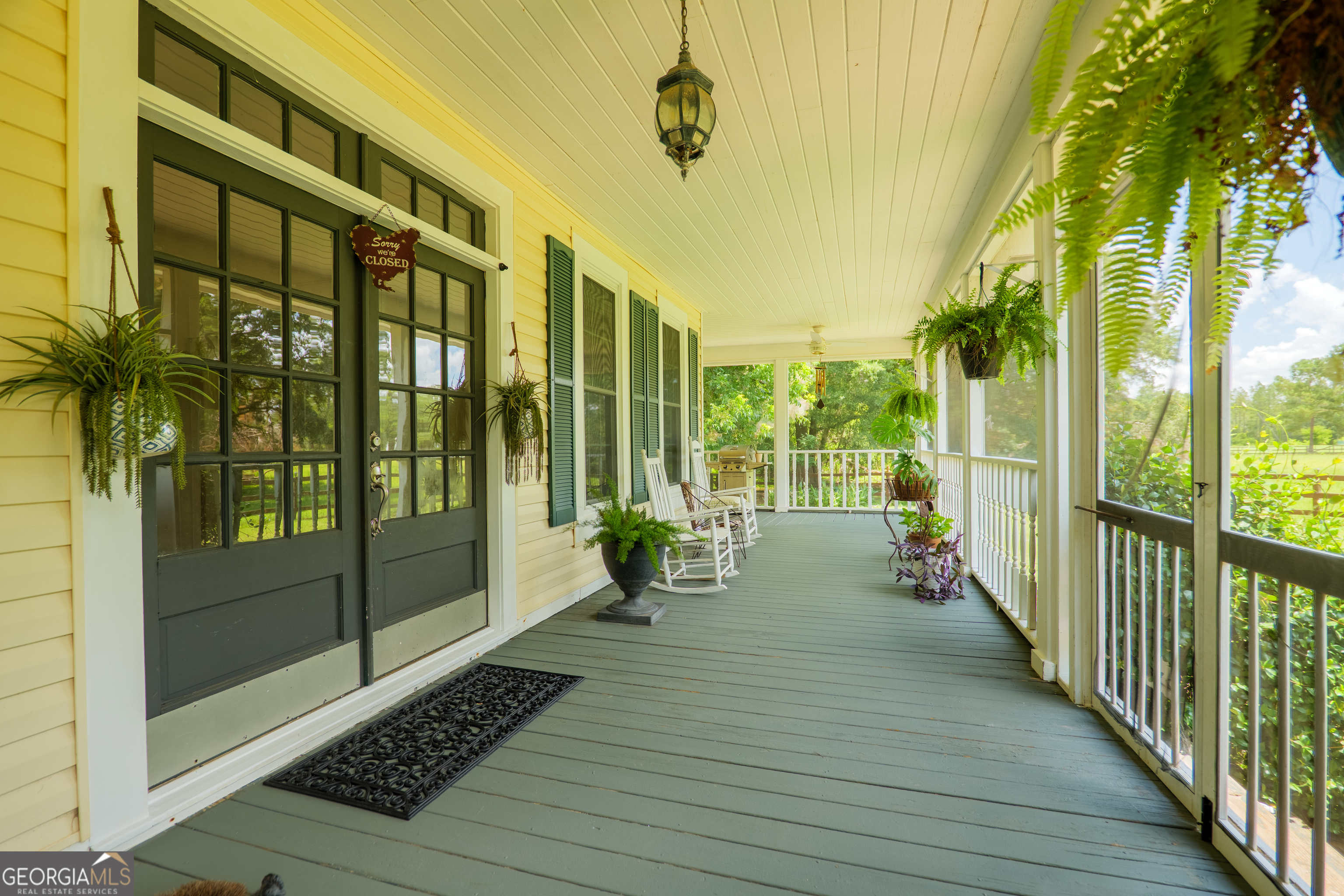 7552 Webb Road Hahira, GA 31632 - Photo 5 of 57 a view of a balcony with wooden floor
