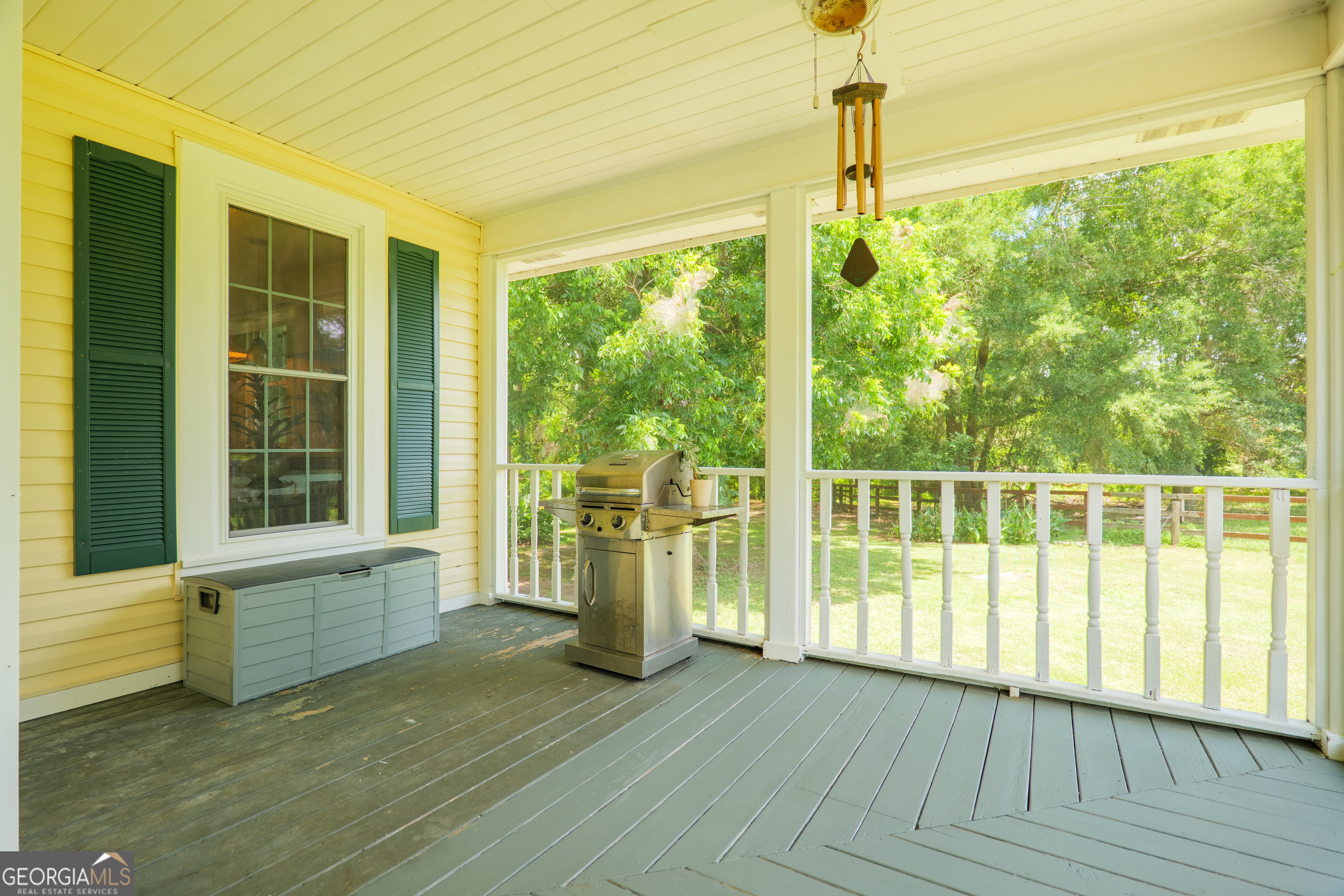 7552 Webb Road Hahira, GA 31632 - Photo 6 of 57 a view of an empty room with wooden floor and a window