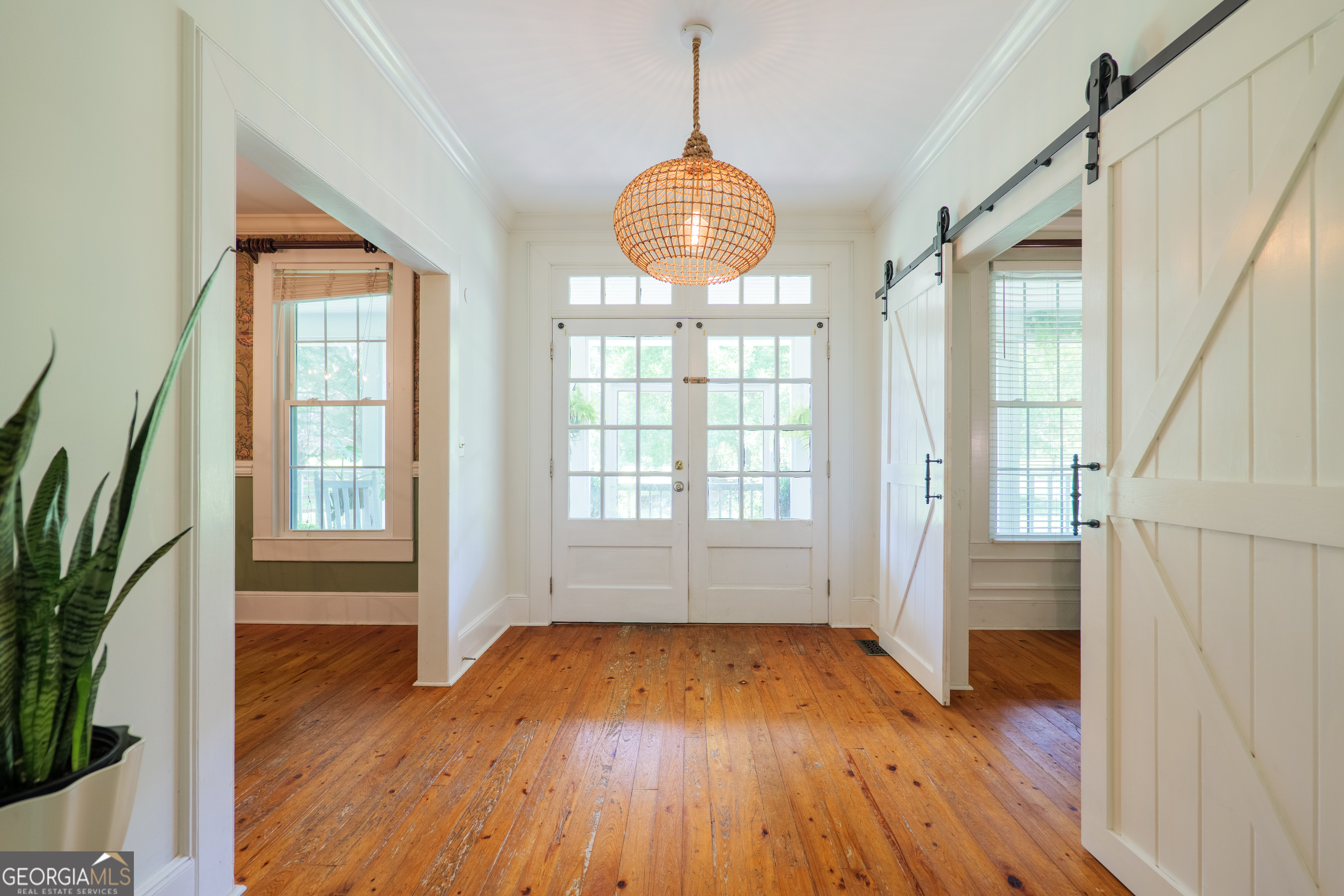 7552 Webb Road Hahira, GA 31632 - Photo 7 of 57 a view of an empty room with wooden floor and a window