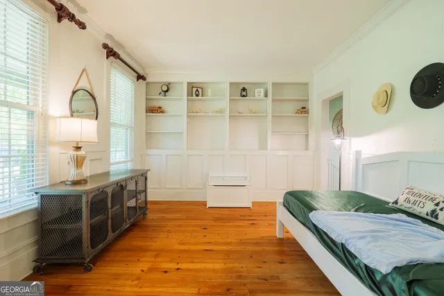 a spacious bathroom with a double vanity sink and a mirror