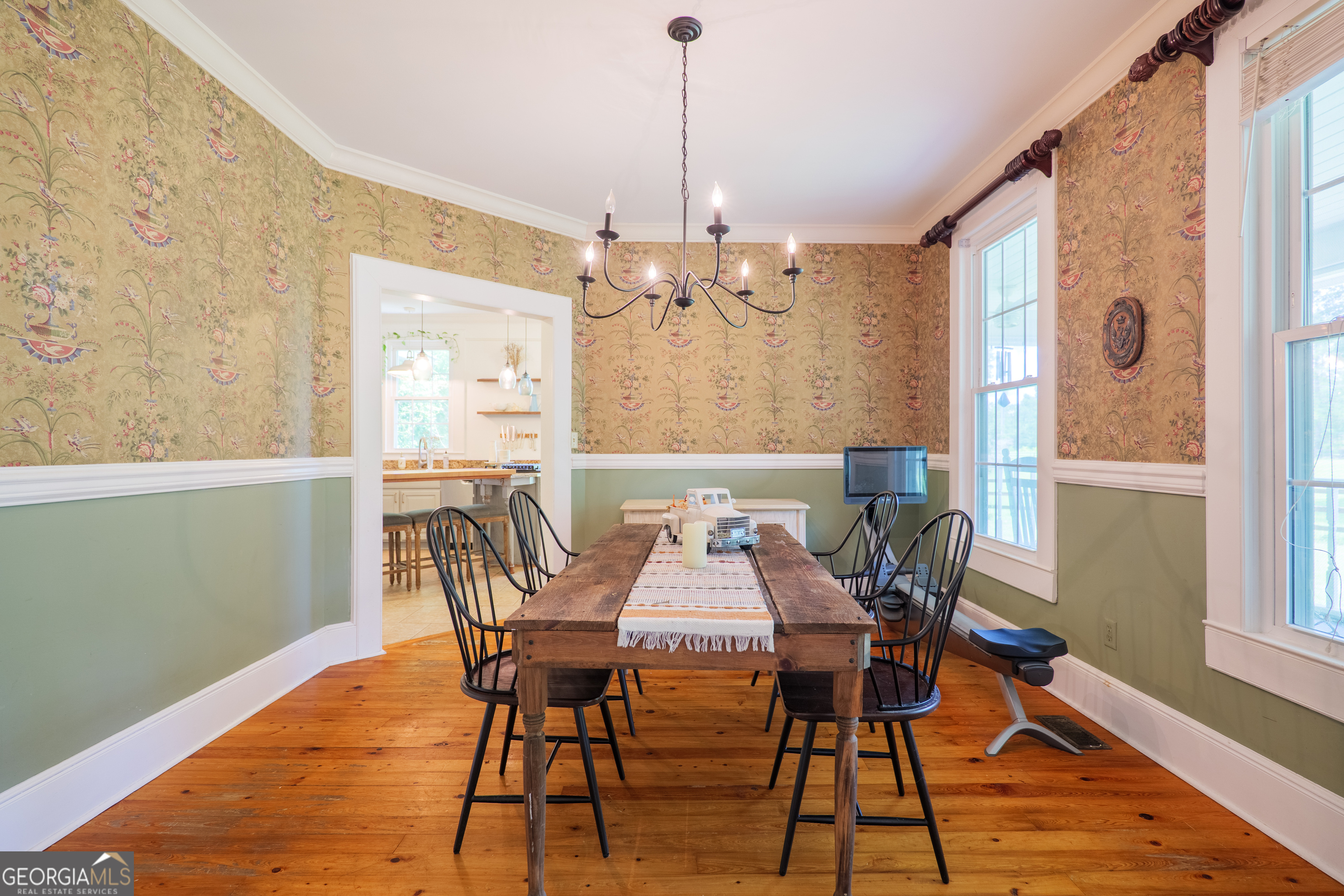 7552 Webb Road Hahira, GA 31632 - Photo 10 of 57 a view of a dining room with furniture window and wooden floor