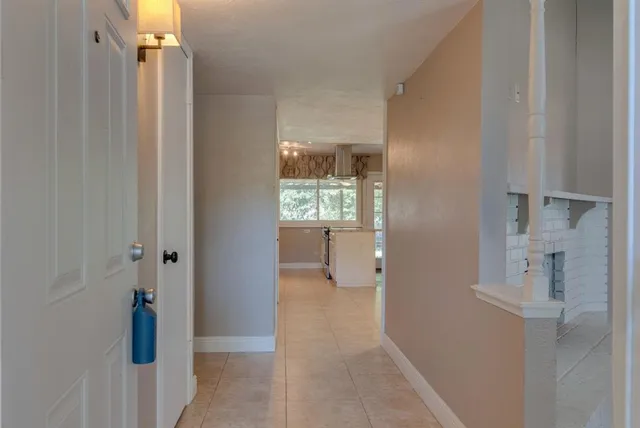 a view of an entryway with wooden floor