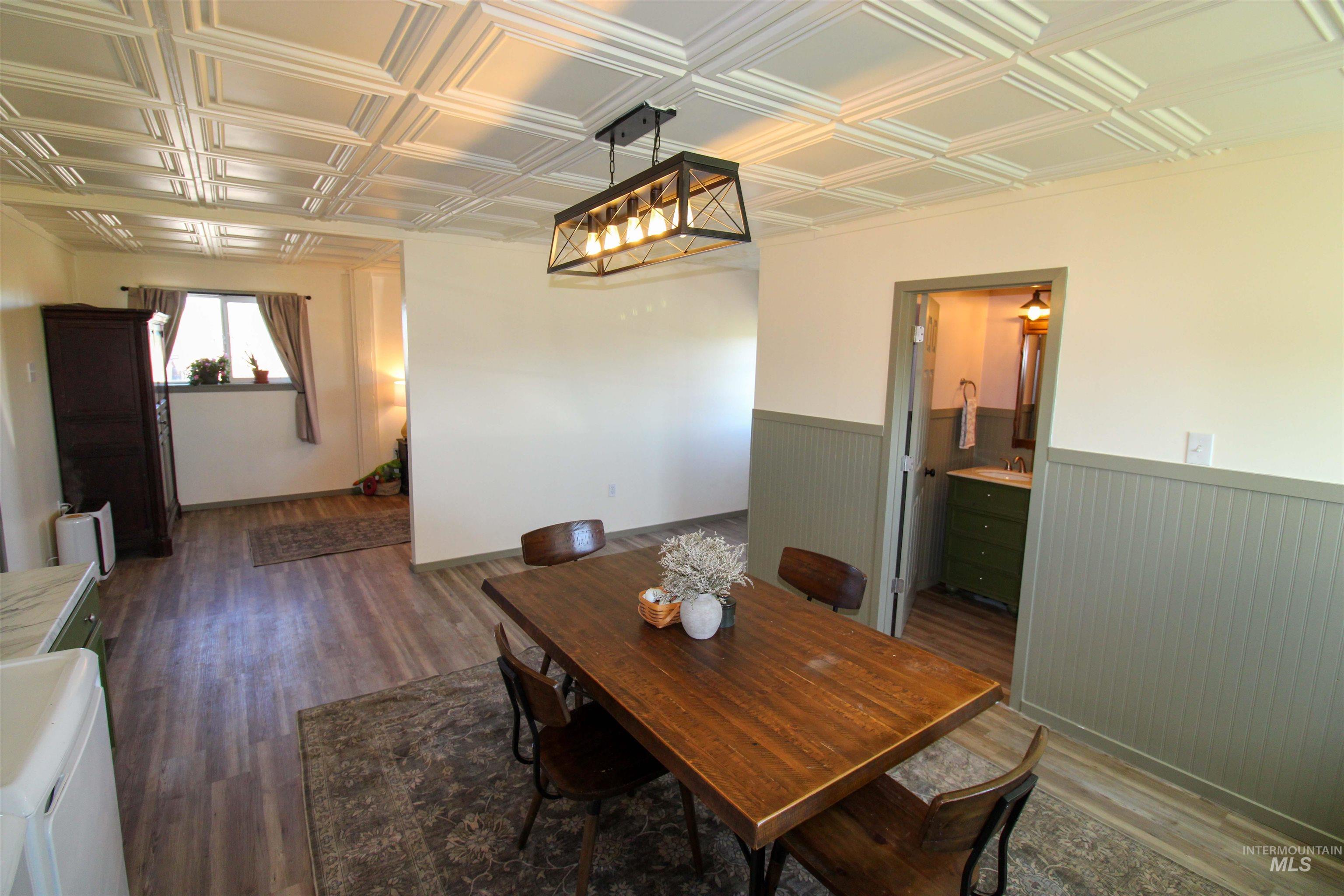 1254 Stuart Road Orofino, ID 83544 - Photo 8 of 48 Wood-finish flooring throughout, complemented by a white coffered ceiling