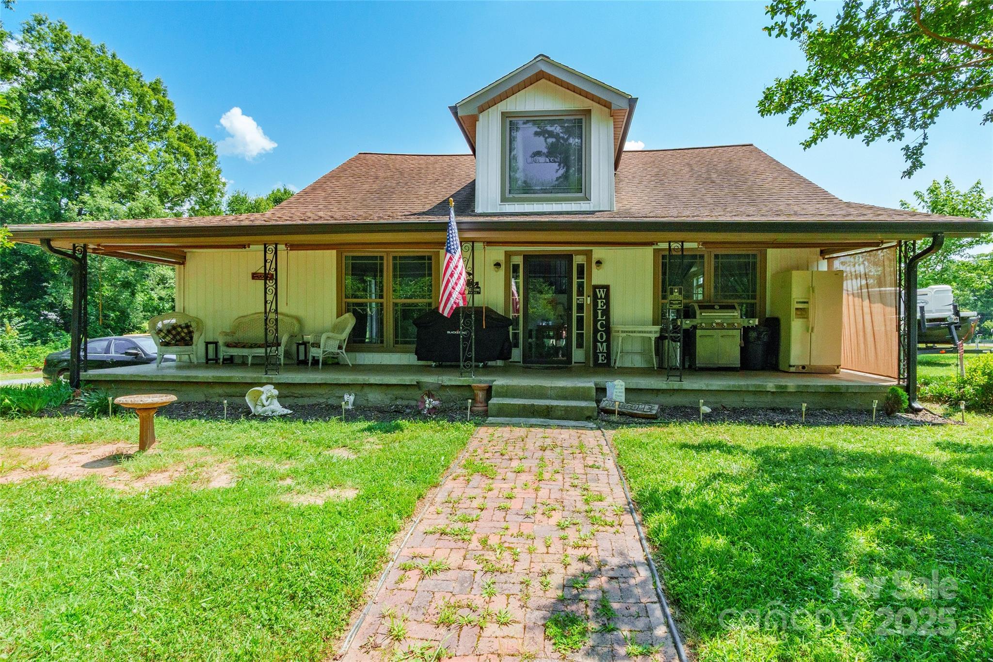 a front view of a house with garden