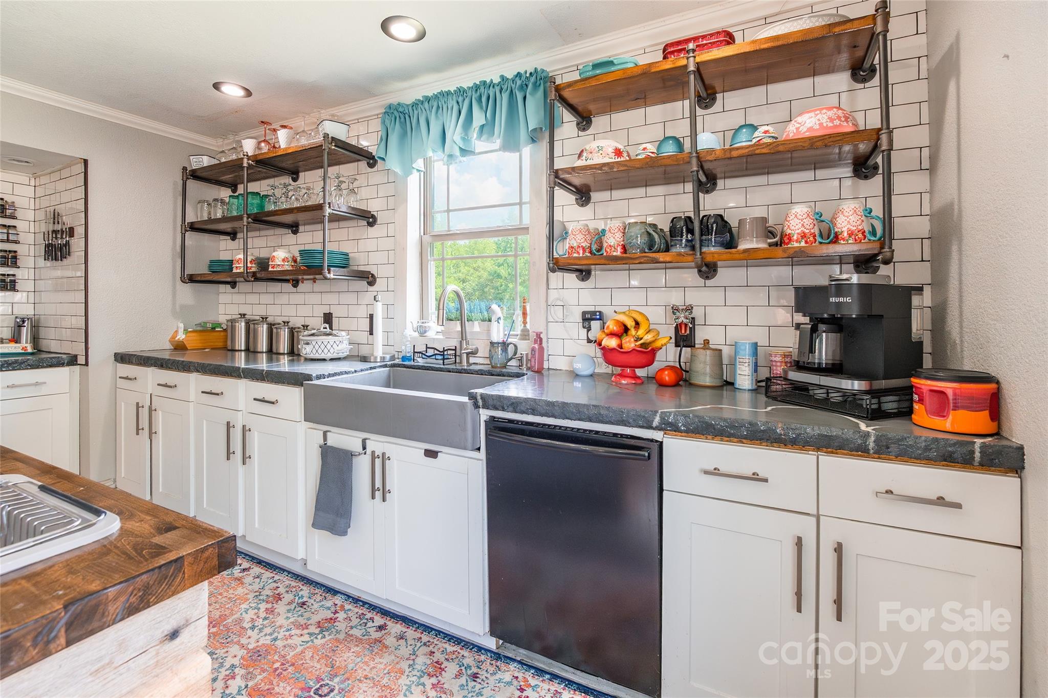 106 Guffey Road Cherryville, NC 28021 - Photo 12 of 41 a kitchen with stainless steel appliances granite countertop a sink and cabinets