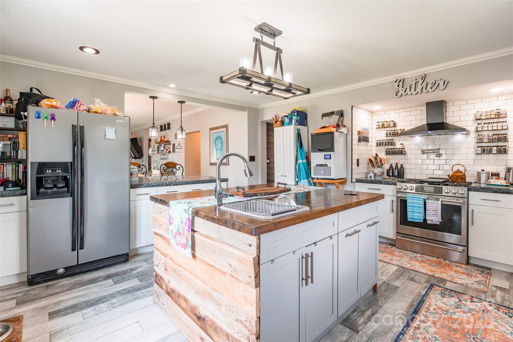 106 Guffey Road Cherryville, NC 28021 - Photo 13 of 41 a kitchen with stainless steel appliances granite countertop a sink and a refrigerator