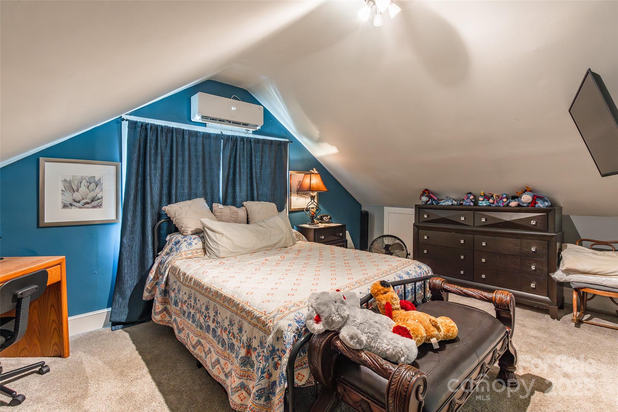 106 Guffey Road Cherryville, NC 28021 - Photo 21 of 41 a bedroom with a bed and dresser with wooden floor