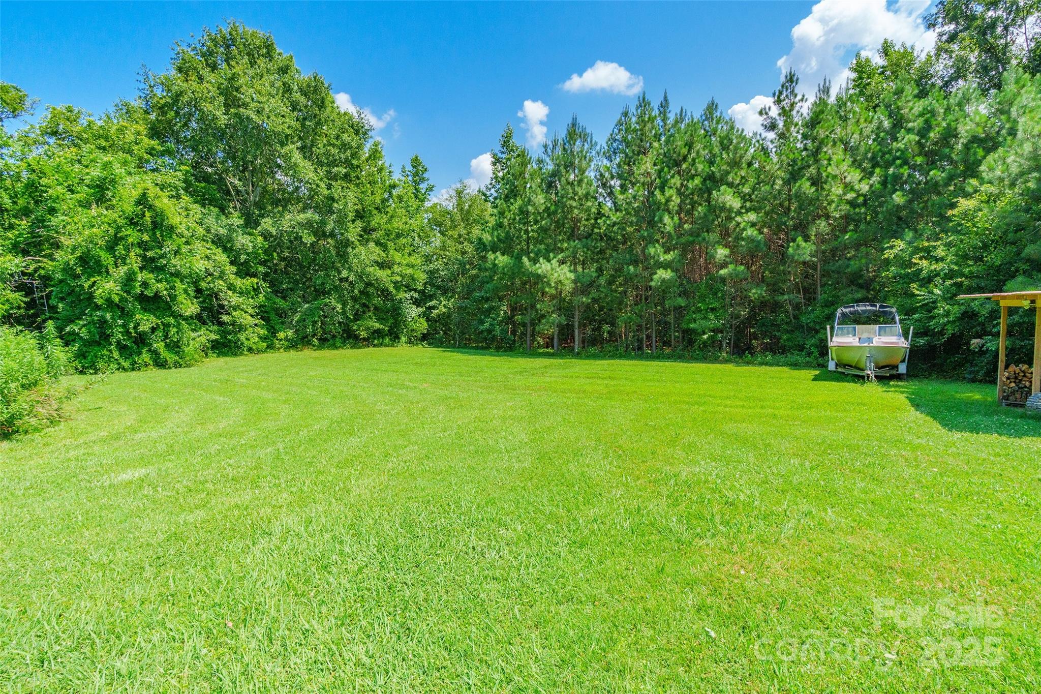 106 Guffey Road Cherryville, NC 28021 - Photo 30 of 41 a view of a grassy field with trees in the background