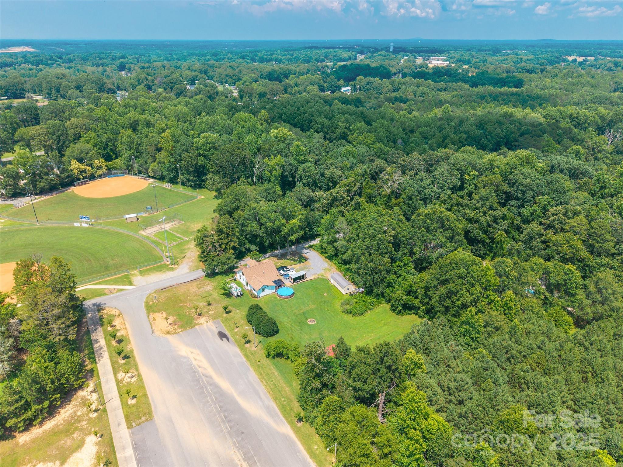 106 Guffey Road Cherryville, NC 28021 - Photo 36 of 41 a view of a city with lush green forest