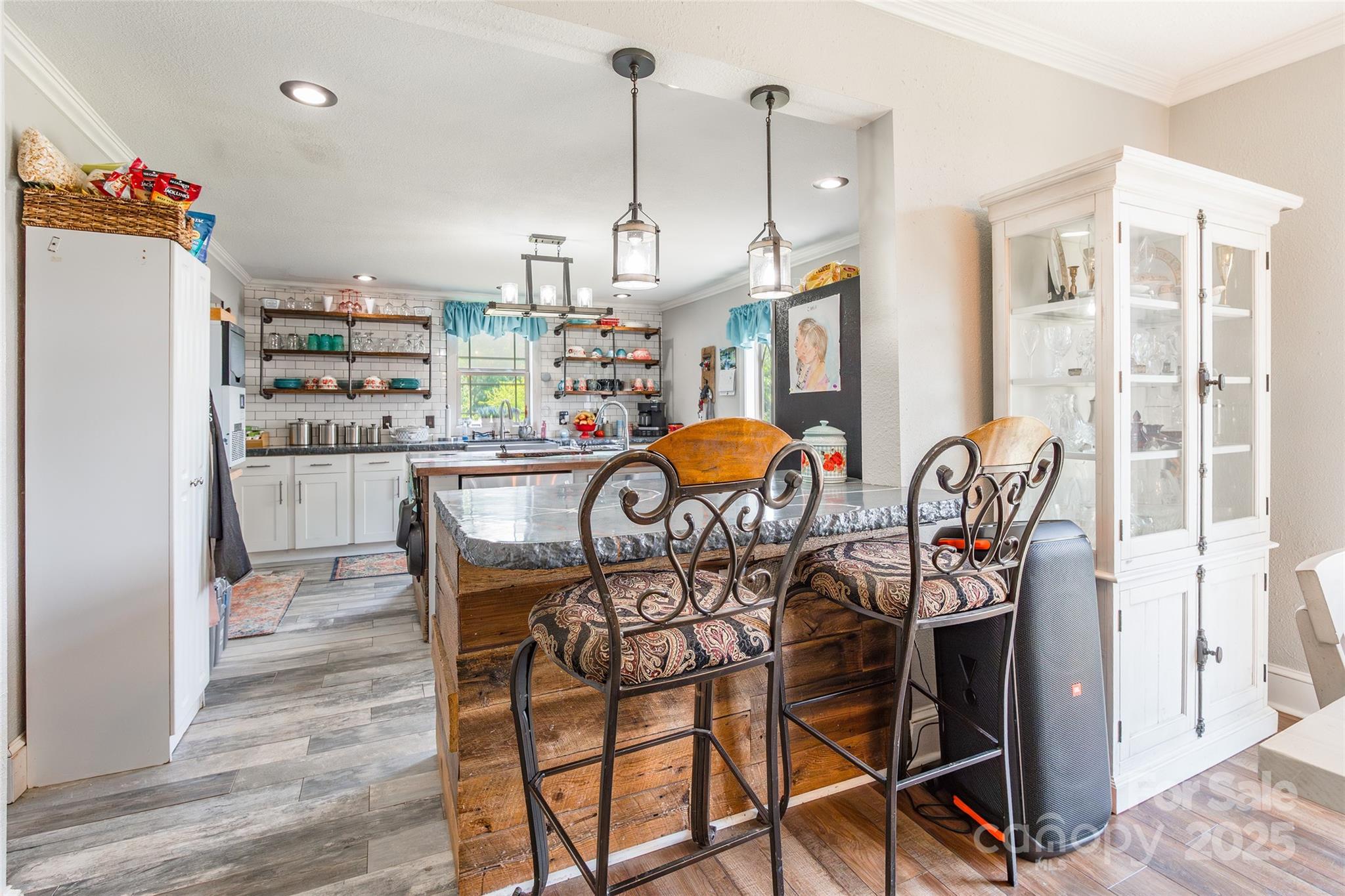 106 Guffey Road Cherryville, NC 28021 - Photo 9 of 41 a view of a dining room with furniture a chandelier and wooden floor