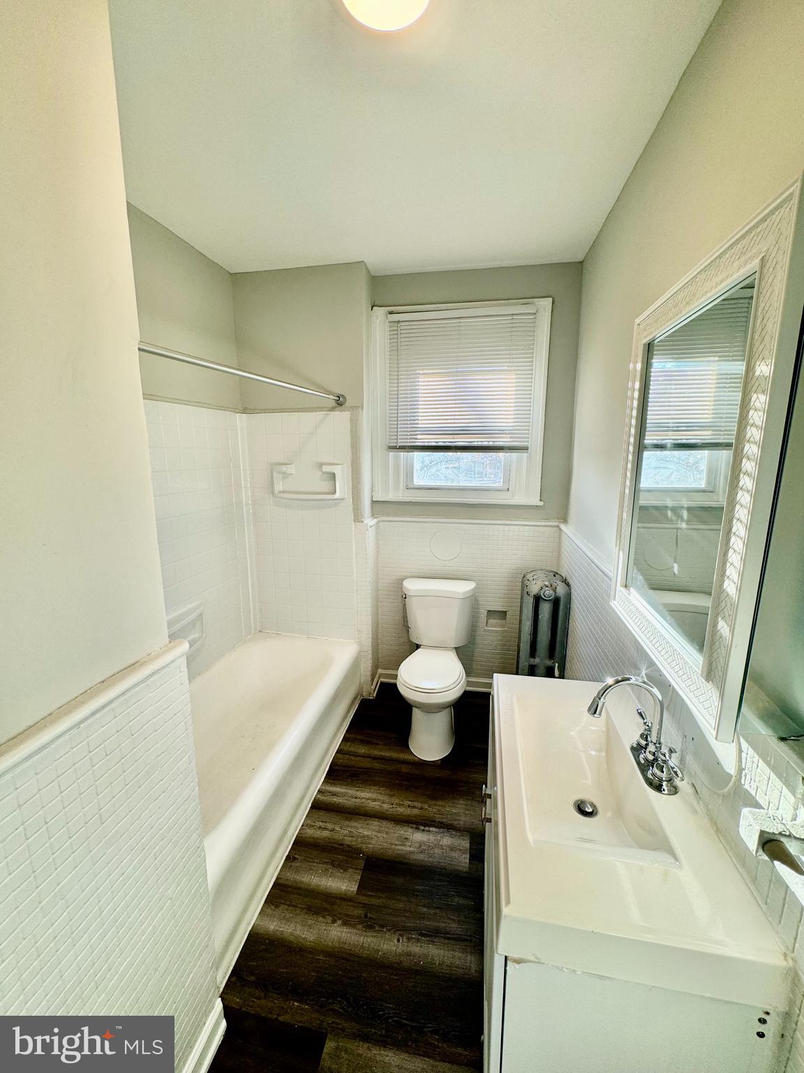 5388 Hazelhurst Street, Unit 3F Philadelphia, PA 19131 - Photo 6 of 6 a bathroom with a sink and a bathtub
