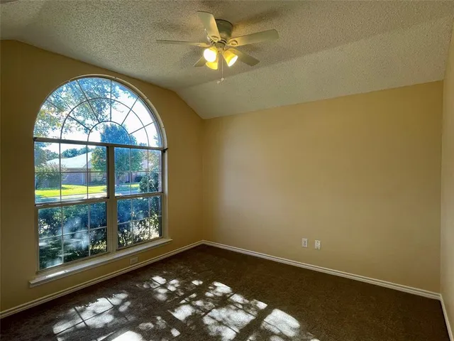 en empty room with window and outdoor view