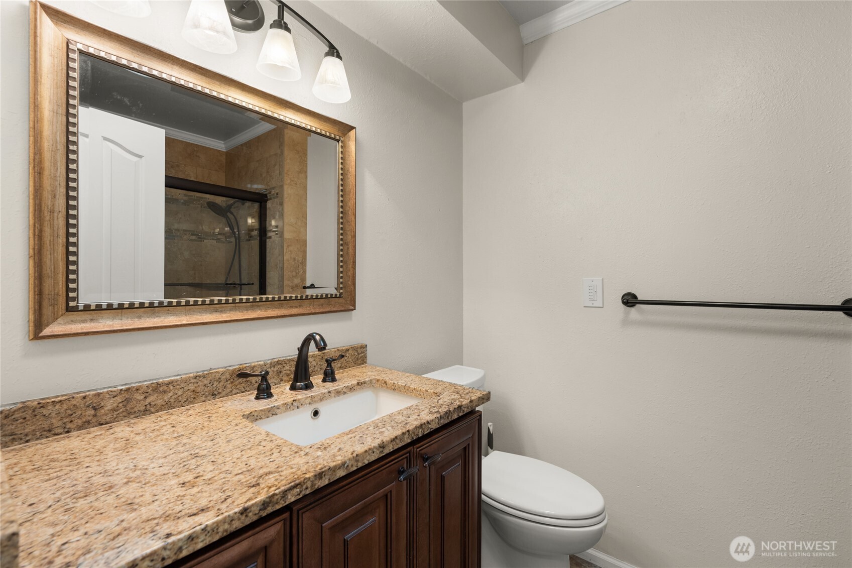 10 Jeffery Place Longview, WA 98632 - Photo 28 of 40 a bathroom with a granite countertop sink toilet and mirror