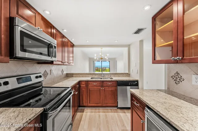 a kitchen with a stove and a microwave