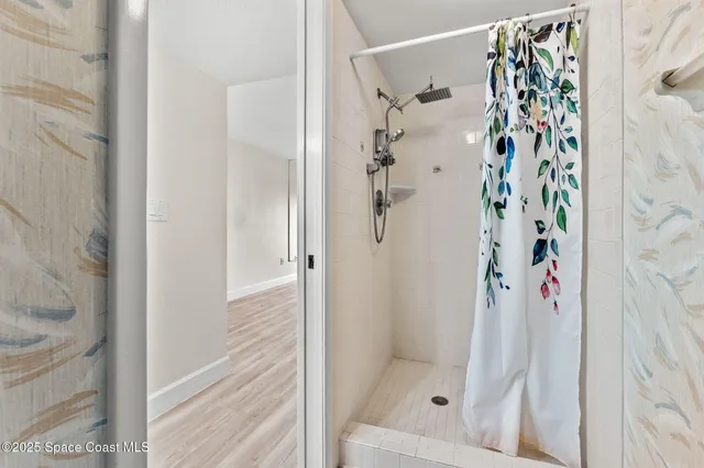 a view of a room with a bed