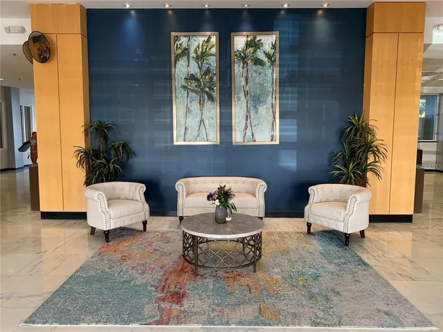 a view of a backyard with a patio table and chairs