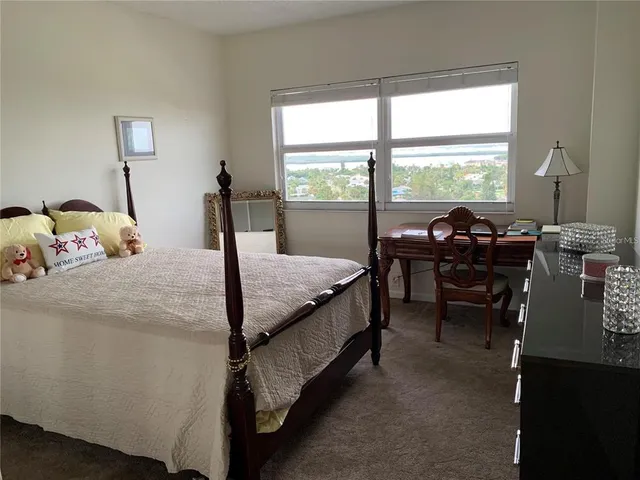 a bed room with a bed and a table