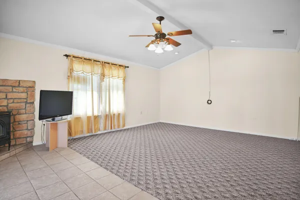 a view of livingroom with furniture and chandelier fan