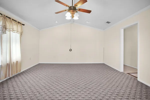 a view of an empty room with a window