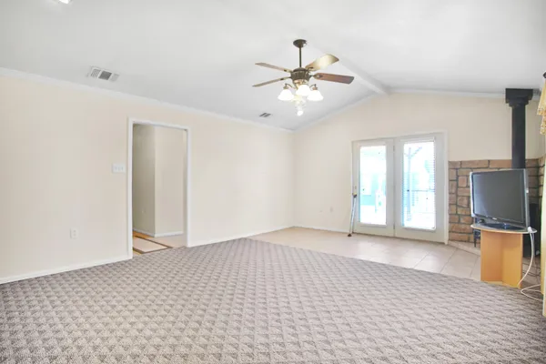 a view of livingroom with hardwood floor and ceiling fan