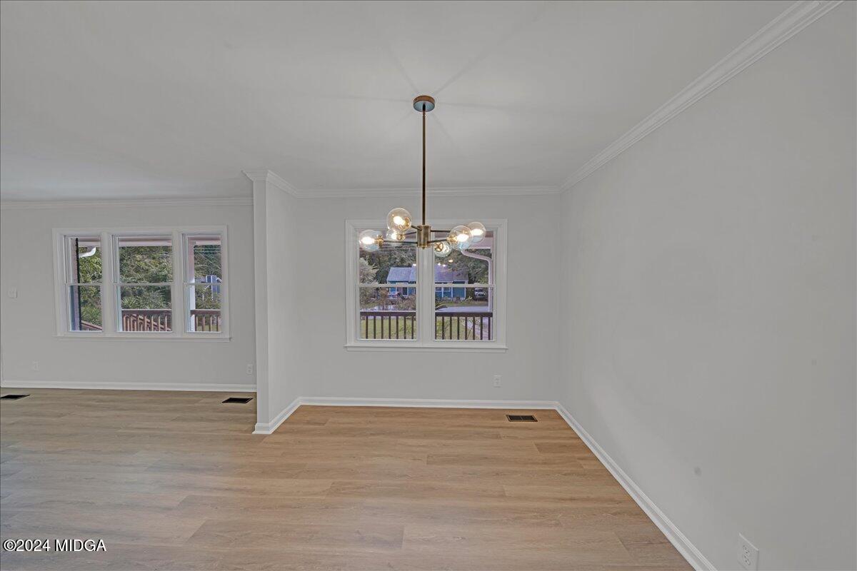 528 Table Mountain Drive Macon, GA 31220 - Photo 13 of 34 a view of an empty room with wooden floor and a window