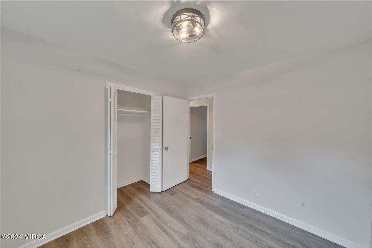 528 Table Mountain Drive Macon, GA 31220 - Photo 18 of 34 a view of empty room with wooden floor and fan