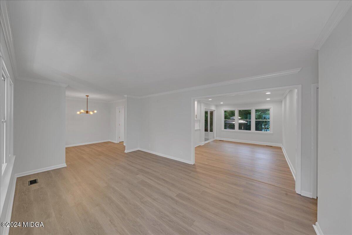 528 Table Mountain Drive Macon, GA 31220 - Photo 4 of 34 wooden floor in an empty room with a window