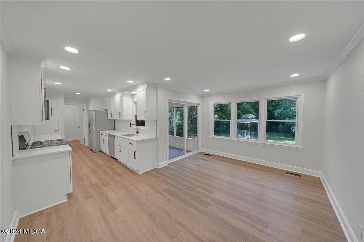 528 Table Mountain Drive Macon, GA 31220 - Photo 7 of 34 a view of kitchen with wooden floor and windows