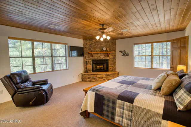 a spacious bedroom with a bed and a couch