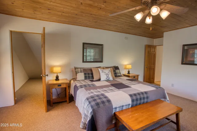 a bed room with a bed and a lamp