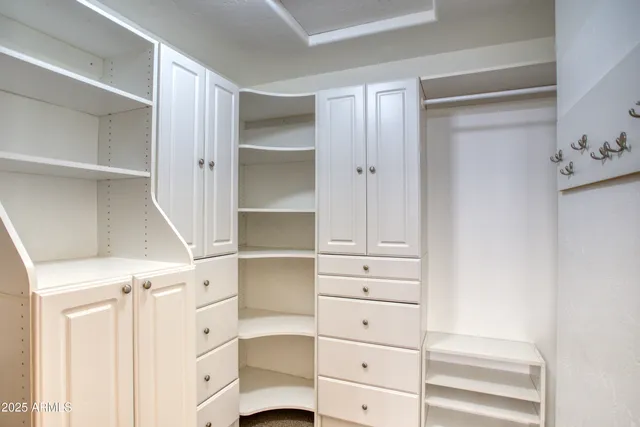 a view of an empty walk in closet