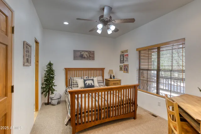 a bedroom with furniture and a chandelier