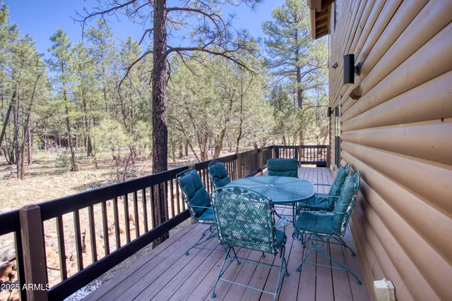 a view of balcony with furniture and wooden deck