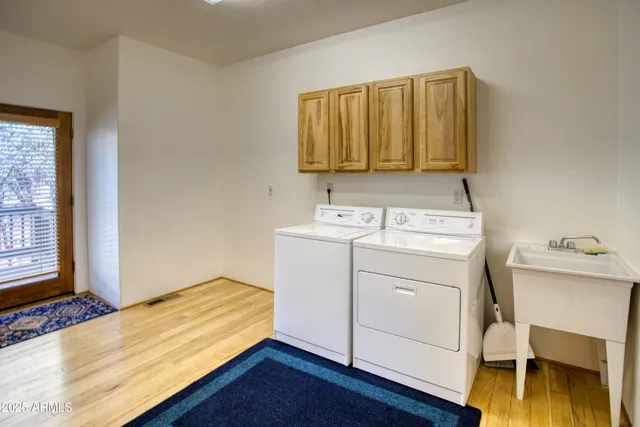 a bedroom with a bed and a chair in it