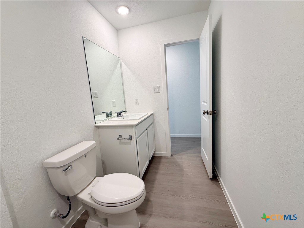 413 Moscato Road New Braunfels, TX 78130 - Photo 19 of 28 a bathroom with a sink toilet and shower