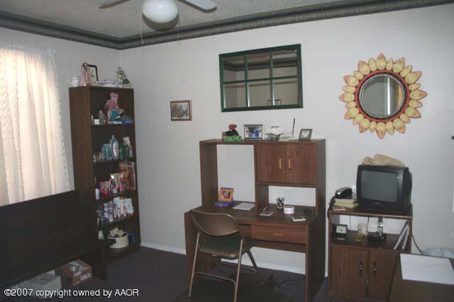 5140 McCarty Boulevard Amarillo, TX 79110 - Photo 6 of 8 a view of a workspace with furniture and window