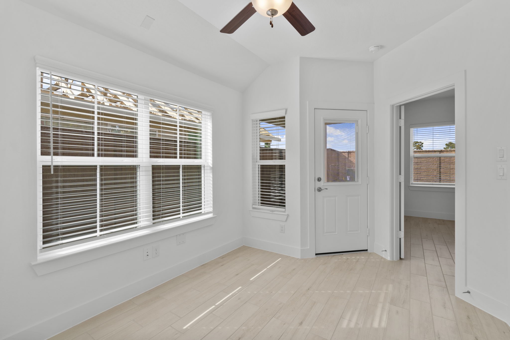 5227 Celestial Court Iowa Colony, TX 77583 - Photo 18 of 43 an empty room with chandelier fan and windows