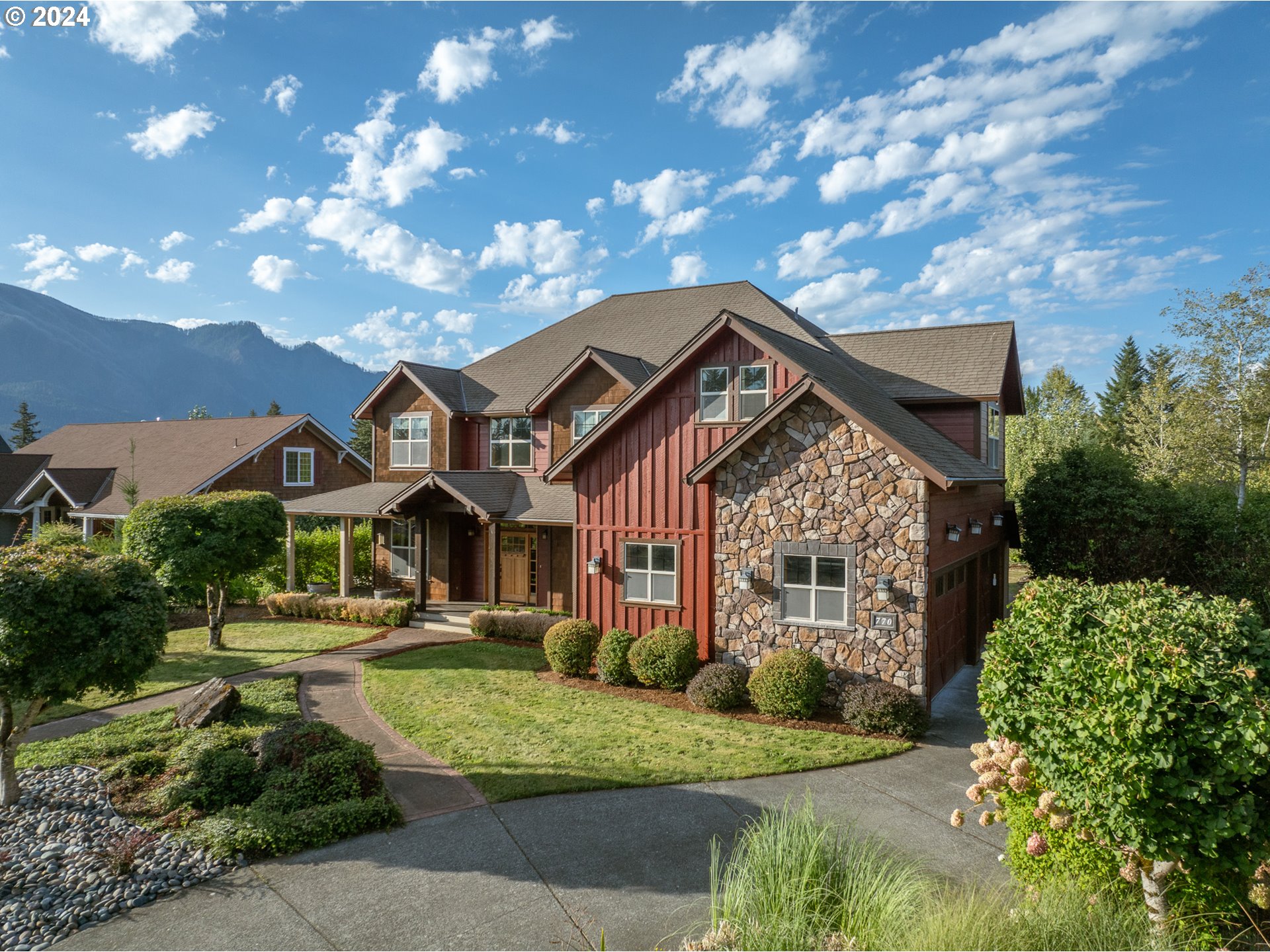 770 Northwest Angel Heights Road Stevenson, WA 98648 - Photo 5 of 39 a front view of a house with a yard