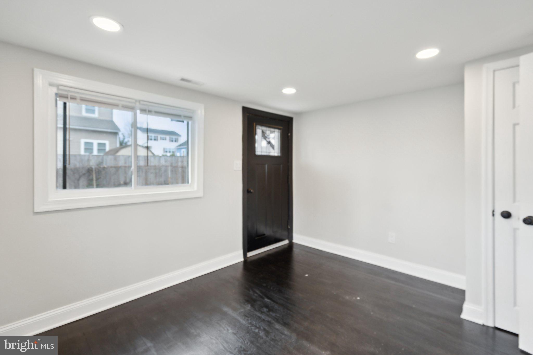 421 Dateleaf Avenue Capitol Heights, MD 20743 - Photo 17 of 39 a view of an empty room with wooden floor and a window