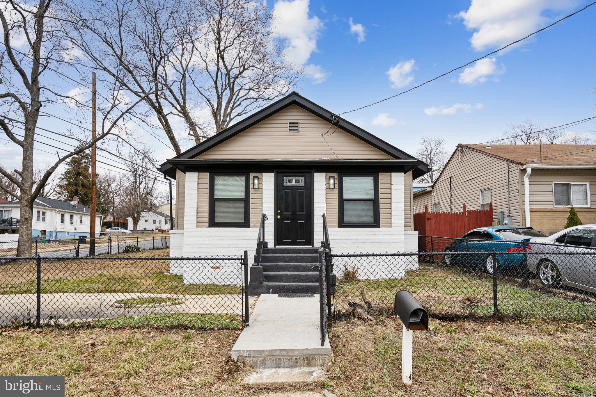 421 Dateleaf Avenue Capitol Heights, MD 20743 - Photo 2 of 39 a front view of a house with garden