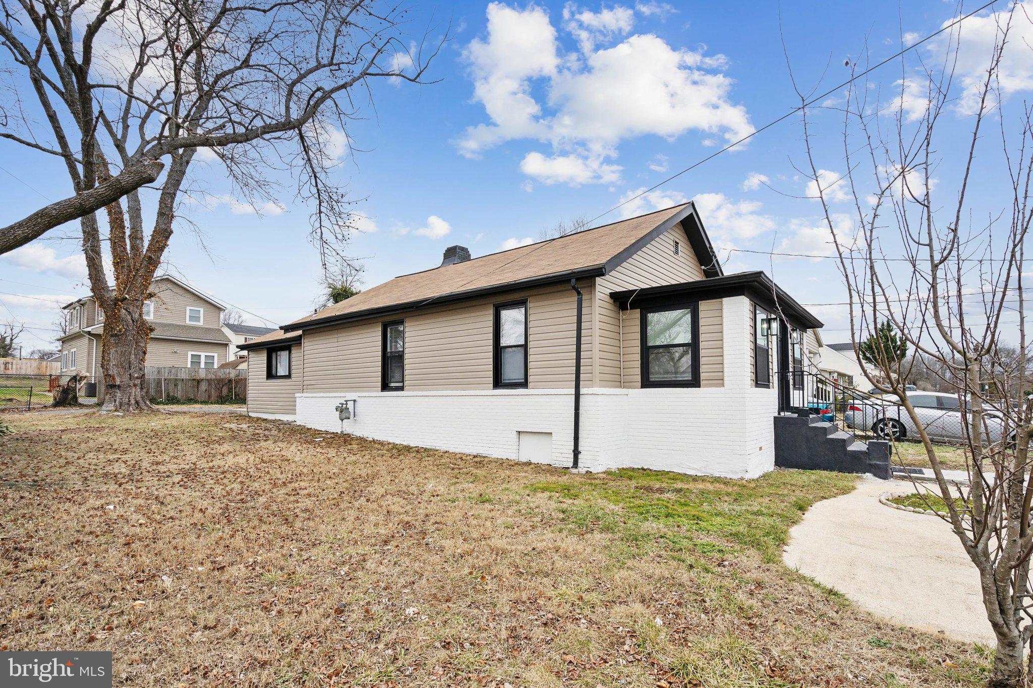 421 Dateleaf Avenue Capitol Heights, MD 20743 - Photo 34 of 39 a front view of a house with a yard and garage