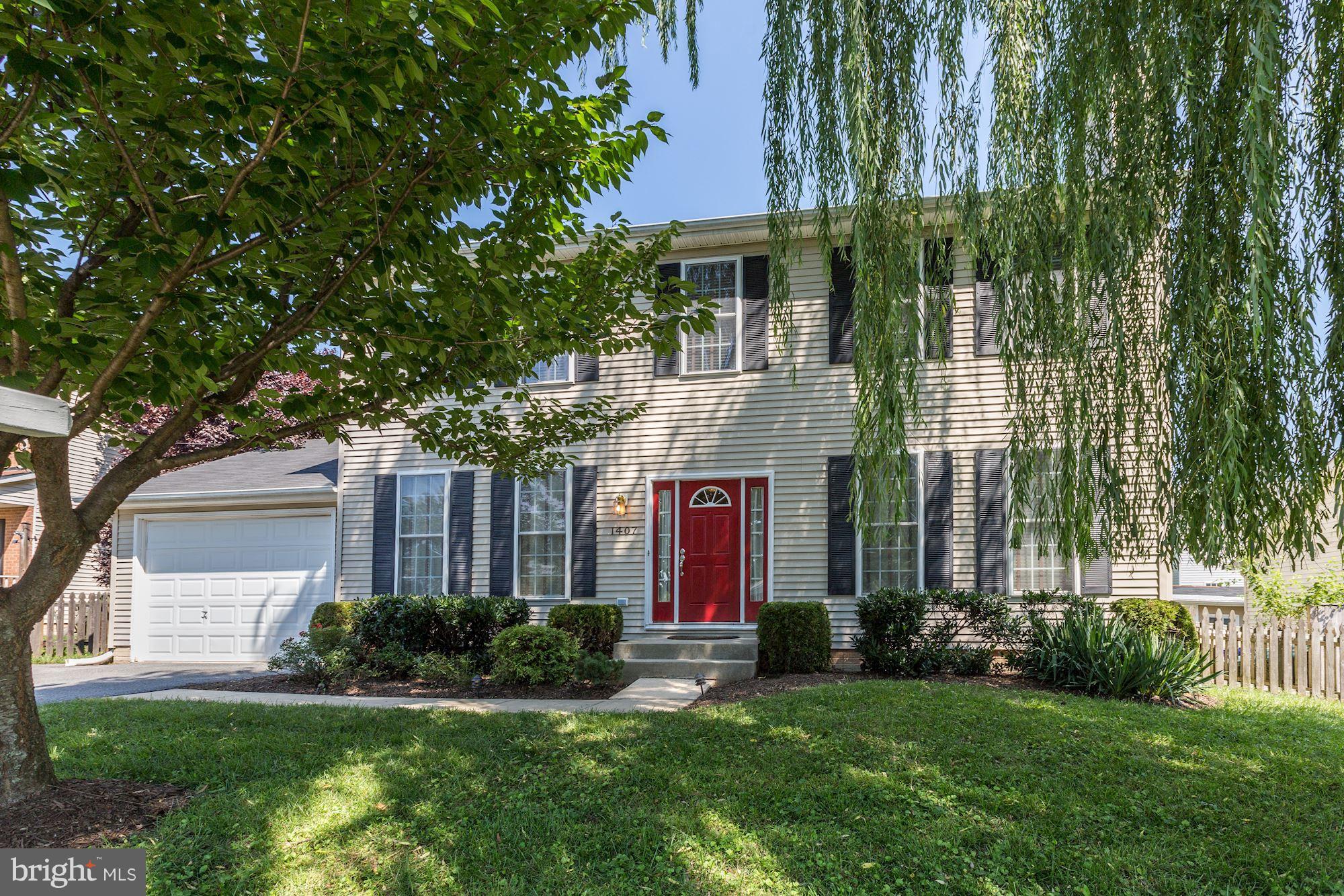 1407 Jasper Street Silver Spring, MD 20902 - Photo 1 of 21 a front view of a house with a yard and tree s