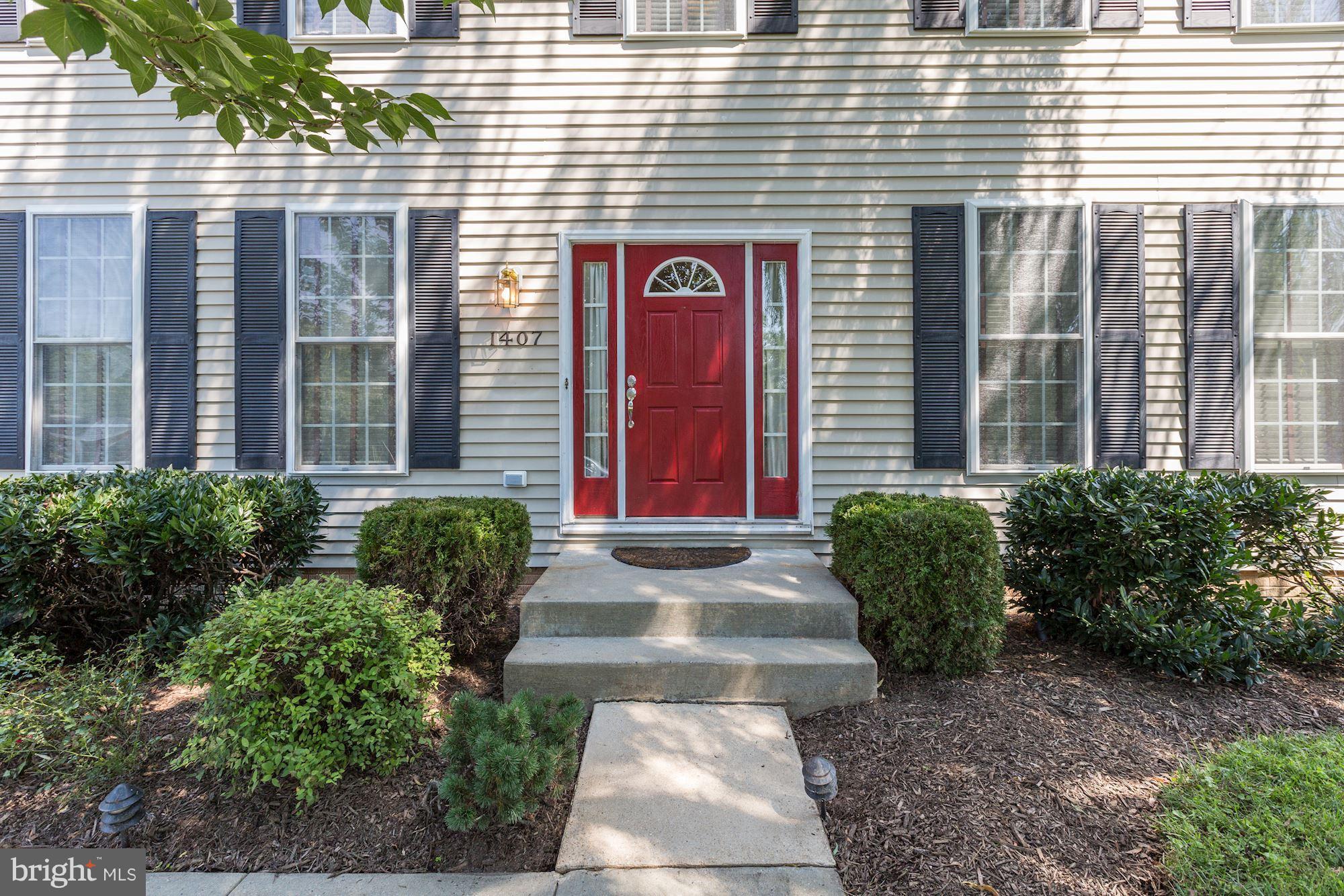 1407 Jasper Street Silver Spring, MD 20902 - Photo 2 of 21 a front view of a brick building with many windows