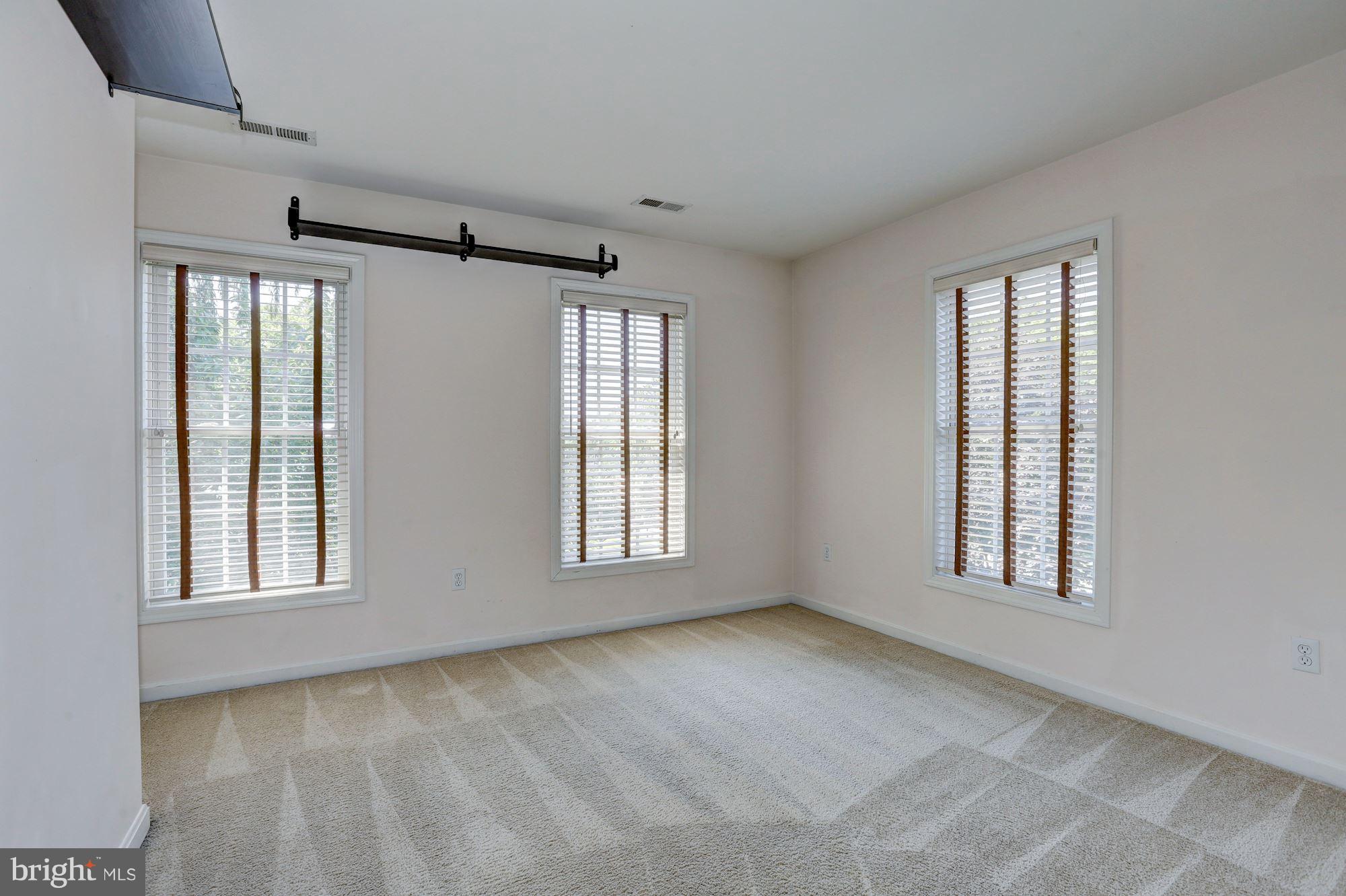 1407 Jasper Street Silver Spring, MD 20902 - Photo 11 of 21 a view of an empty room with a window